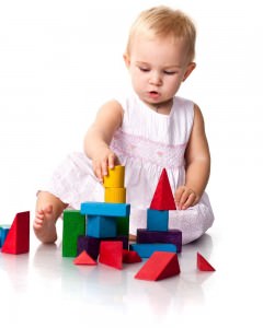 Beautiful baby building a castle